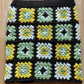 Brown, green, yellow and white crochet granny square skirt