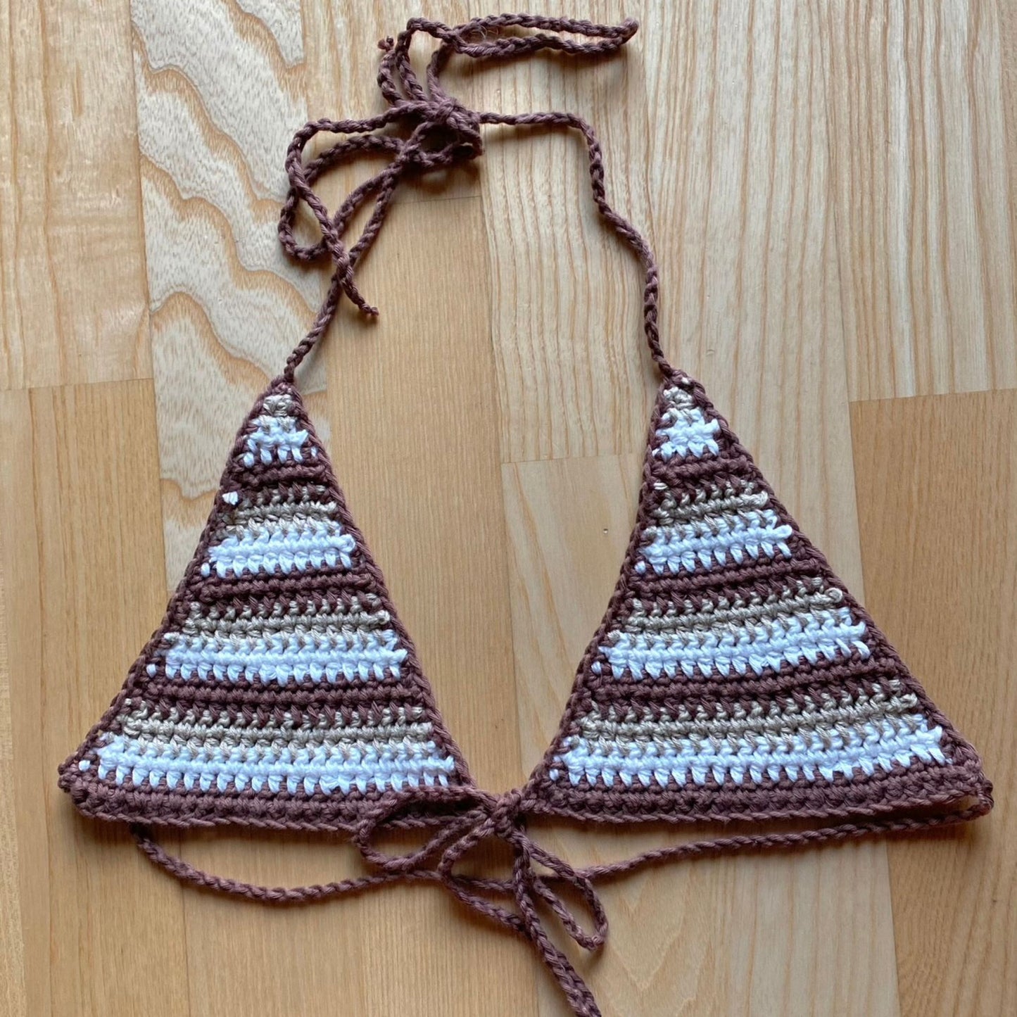 Brown, beige and white striped crochet triangle bikini top that ties around the neck and in the front under the breast